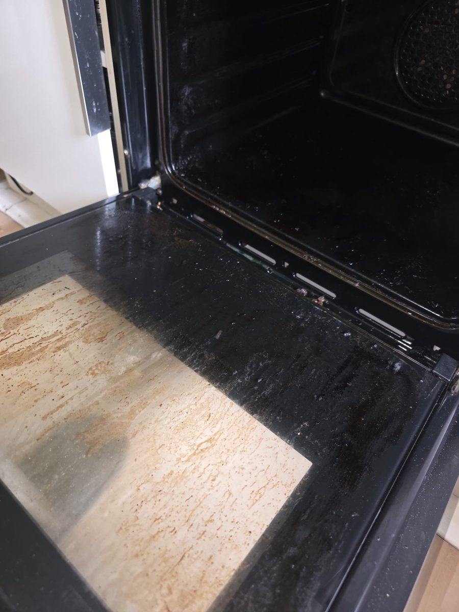 Oven door glass before deep clean