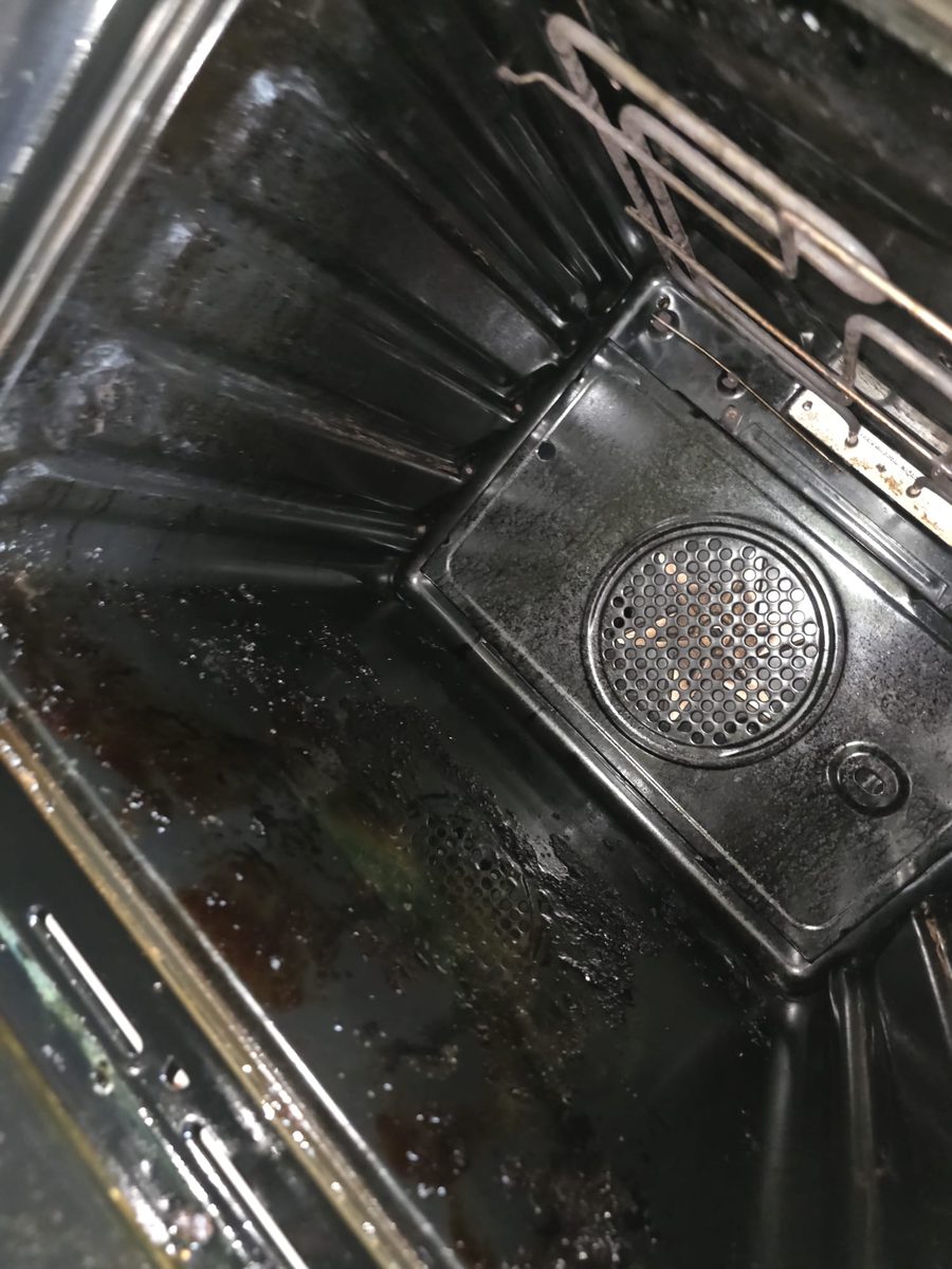 Oven fan and rear wall before deep clean