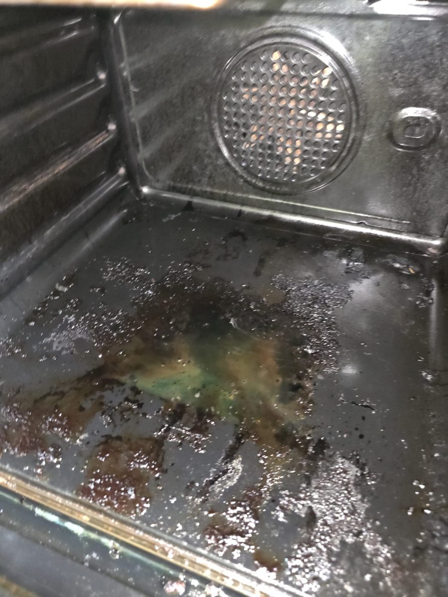 Oven racks and floor before deep clean